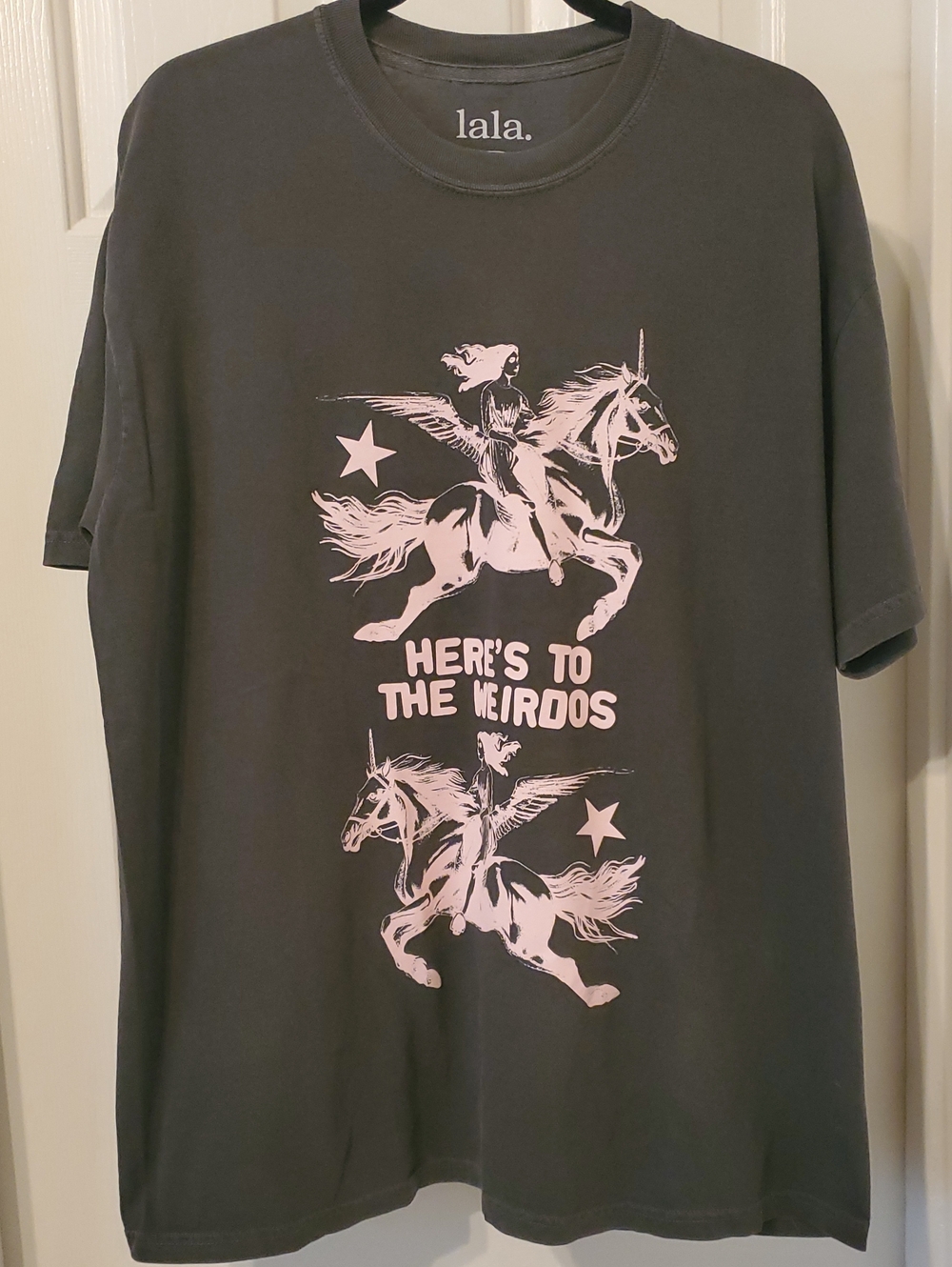 Dressed in LALA Black Tee with Pale Pink Unicorn Graphic and Slogan